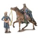 Reyes a caballo con pajes