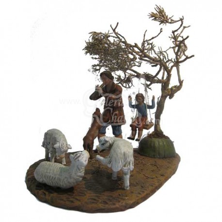 Pastor con ovejas, perro y niño en columpio