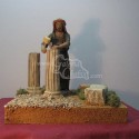 Pastor móvil esculpiendo columna