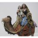 Pastora en camello con niño